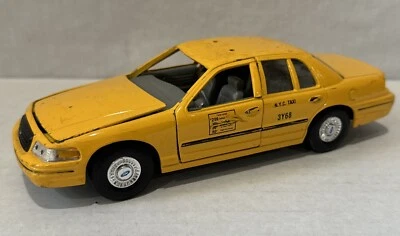 Welly Diecast 1999 Ford Crown Victoria Vic Yellow Taxi NYC  8” Missing Parts - Image 1 of 4