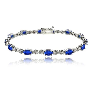 Oval Infinity Created Blue Sapphire & White Topaz Bracelet in Sterling Silver - Picture 1 of 3