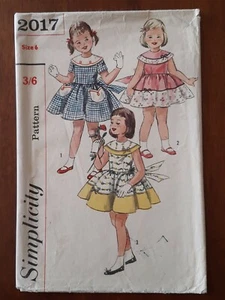 SIMPLICITY PATTERN - 2017 GIRL'S DRESS ROUND COLLAR TULIP POCKET SIZE 6 UNCUT - Picture 1 of 2