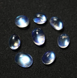 Cabochon ovali pietra di luna arcobaleno blu naturale lucido da 6,3x4,9 a 7,6x5,5 mm - Foto 1 di 11