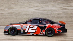 Team Caliber #12 Jeremy Mayfield Mobil 1 25th Anniversary Ford Taurus Bank 1:24 - Picture 1 of 9