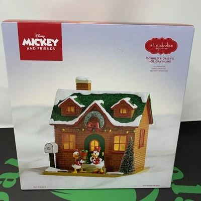 St. Nicholas Square Disney Donald & Daisy's casa de vacaciones iluminada 2024 Foto 1 de 4