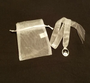 DISNEY PARKS SILVER TONE OVAL CINDERELLA'S CASTLE CHARM WITH RIBBON & POUCH - Picture 1 of 6