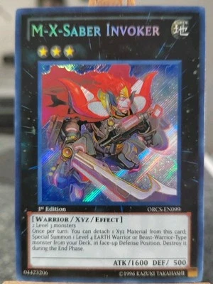 M-X-SABER INVOKER - ORCS-EN099 Secret Rare / 1st Edition Near Mint  - Bild 1 von 2