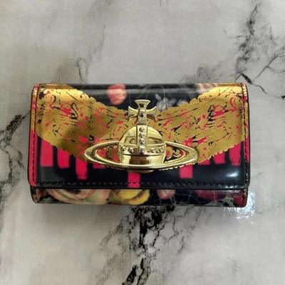 RARO Estuche para llaves Vivienne Westwood vintage para mujer logotipo de flor orbe usado de Japón FS Foto 1 de 3