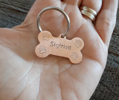 copper dog tag in bone shape - Image 1 of 4