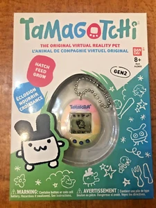 TAMAGOTCHI ORIGINAL GEN 1 ELECTRONIC PET PURPLE PINK CLOCK BANDAI 2018 NEW - Picture 1 of 2