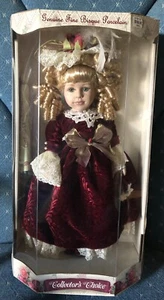 COLLECTORS CHOICE Biskuitporzellan Mädchen Puppe blonde Banane Locken rotes Kleid ~ MIB - Bild 1 von 5