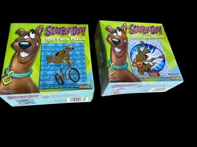 Scooby-Doo lot of 2  Puzzle 100 Pieces Playing Guitar Riding Bike 2005 Sealed - Image 1 of 2