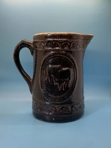 Salt Glazed Brown Iron Stone Pitcher With Two Grazing Cows on Either Side - Picture 1 of 2