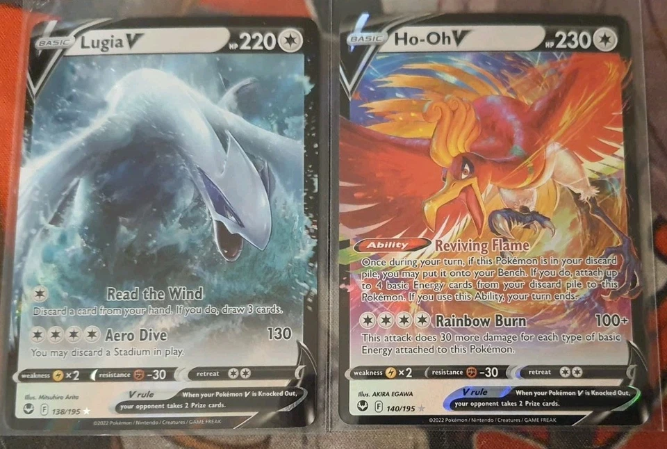 Juego de cartas coleccionables Pokémon Lugia V 138/195 y Ho-Oh V 140/195 Silver Tempest casi como nuevo Foto 1 de 1