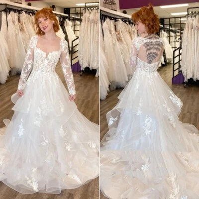 Vestidos de novia de manga larga con cuello cuadrado volantes sin espalda elegantes vestidos de novia Foto 1 de 4