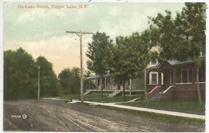 Tupper Lake NY older mint color postcard depicting homes, etc., on Lake Street - Picture 1 of 2