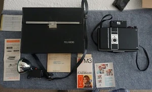 Cámara terrestre automática vintage Polaroid 335 con estuche y accesorios - Imagen 1 de 11