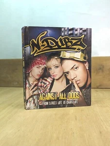 N - DUBZ : Against All Odds ~ Rise To Fame Biographical Hardback Book ~ 2010 VG - Picture 1 of 6
