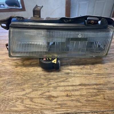 Faro lateral izquierdo del conductor Nissan Máxima 1987 a 1988 fabricante original Foto 1 de 4
