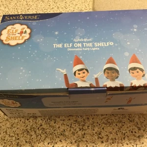 NEU VERPACKT SANTAVERSE DIE ELFE IM REGAL DIMMBARE LICHTERKETTE M&S LUMINSTELLA - Bild 1 von 8