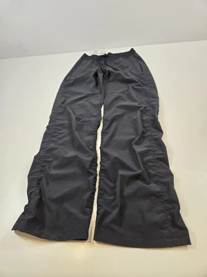 Pantalones Under Armour para mujer pequeños negros Storm Allseasongear resistentes al agua UA Foto 1 de 4