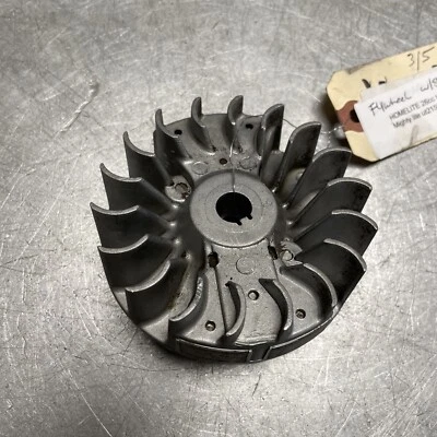 OEM GOOD USED HOMELITE 26CC MIGHTY LITE UT21566 TRIMMER FLYWHEEL W/ STARTER DOGS - Image 1 of 3