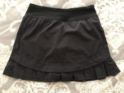 Falda corta forrada Ivivva By LULULEMON plisada con volantes niñas talla 12 negra Foto 1 de 4