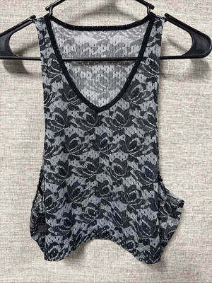 Camiseta deportiva para mujer Nike negra floral material cuello en V músculo activo talla L Foto 1 de 4