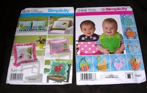TWO NEW UNUSED SIMPLICITY 2468 & 1929 BABY GIFT CRAFTS PATTERNS - BIBS, PILLOWS - Picture 1 of 3