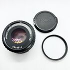 Objectif Nikon Series E 50 mm 1:1,8 avec capuchon Canon avant et filtre Kalimar