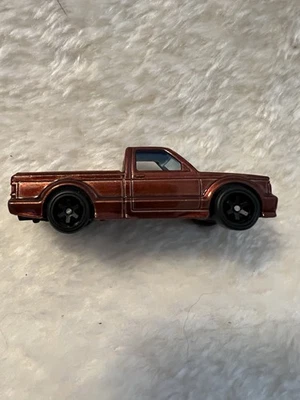 Prototipo de camioneta Hot Wheels '91 GMC Syclone roja con pilotos reales Foto 1 de 3