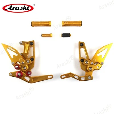 Reposapiés ajustables para Triumph Speed Triple 1050 2011-2015 Arashi DORADO Foto 1 de 4