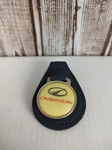 VINTAGE OLDSMOBILE AUTO BLUE LEATHER KEY CHAIN RING FOB - Picture 1 of 2