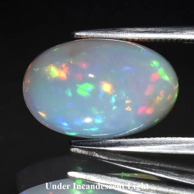 💎 4,26 quilates 13,8 x 8,8 mm cabujón ovalado ópalo blanco natural - juego de colores, gema de Etiopía Foto 1 de 4