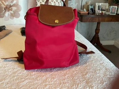Red Folding Longchamp Le Pilage Backpack excellent condition with leather flap - image 1 of 3