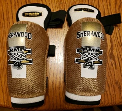 Cotovelo de hóquei Sher-Wood PMP X 4 tamanho juvenil grande? - Imagem 1 de 3
