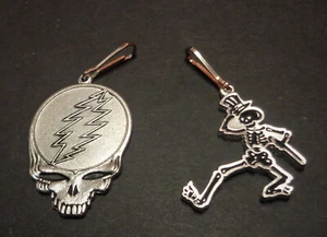 Neu - 2 Disc Golf Zipper Pulls.  Steal Yor Face & Dancing Skeleton - Bild 1 von 3
