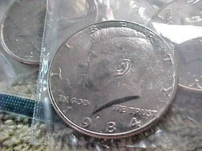  1984 P KENNEDY HALF DOLLARS UNCIRCULATED  IN CELLO - Image 1 of 3