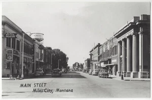 1950's Miles City, Montana - REAL PHOTO Main Street, Old Autos, Signs, Postcard - Picture 1 of 2