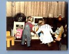 FOUND COLOR PHOTO H+1905 GIRLS FROM BEHIND PLAYING WITH TOYS