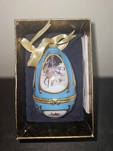 Caja de baratija adorno huevo musical Mr Christmas azul y dorado de Valerie Parr Hill - Imagen 1 de 9
