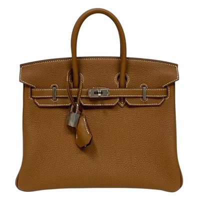 Bolso de mano HERMES Birkin 25 Verso Togo estampado dorado grafito con (2024) Foto 1 de 4