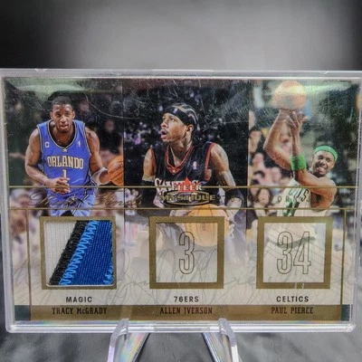 Tarjeta de camiseta Fleer Skybox McGrady 2004 McGrady/Iverson/Pierce 15/30 🏀 Foto 1 de 2