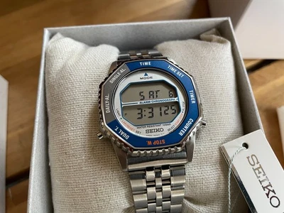 Reloj digital de cuarzo de acero inoxidable Seiko Rotocall SMGG21/SBJG021, nuevo en caja Foto 1 de 4