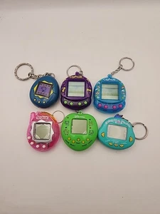 Giga Pets Elektronik Spiel 6 Stück Digital Haustier Tamagotchi Schlüsselanhänger Digi Hund - Bild 1 von 13