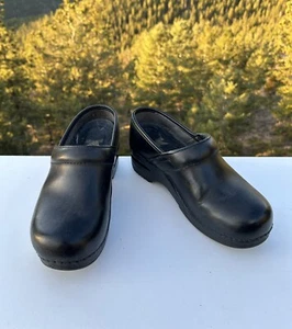 Zoccoli donna Dansko neri EUR 37 - 6,5 - Foto 1 di 8