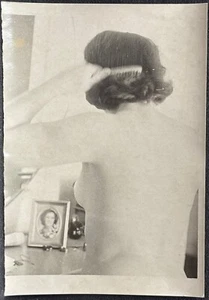Photograph of Rear View of Nude Bare Breasted Woman Brushing Her Hair - Picture 1 of 3