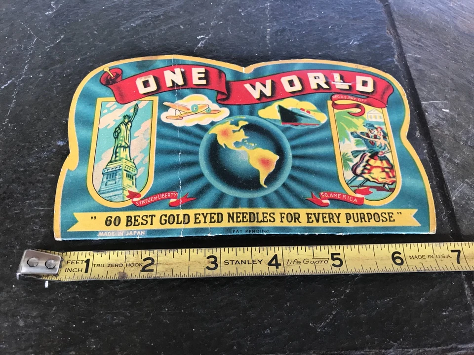 Antiguo soporte de aguja publicitaria de cartón One World "Mejores agujas de ojos dorados" Foto 1 de 4