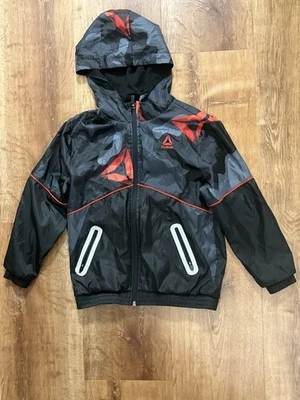 Chaqueta cortavientos Reebok para niños S (6/7) azul/negro cremallera completa Foto 1 de 4