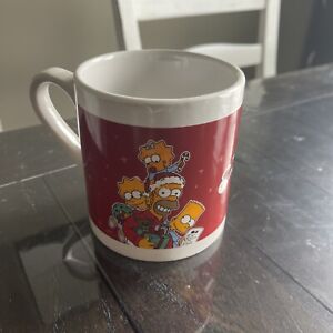 The Simpsons coffee mug Christmas 2010. Red 12 Oz