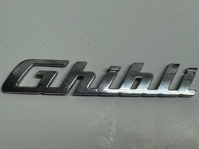 2014-2017 Maserati Ghibli Trunk Lid Emblem Badge Glossy Chrome 670008315 OEM - Image 1 of 2