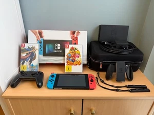 Nintendo Switch Konsole mit Zubehörpaket und Spielen - Bild 1 von 4