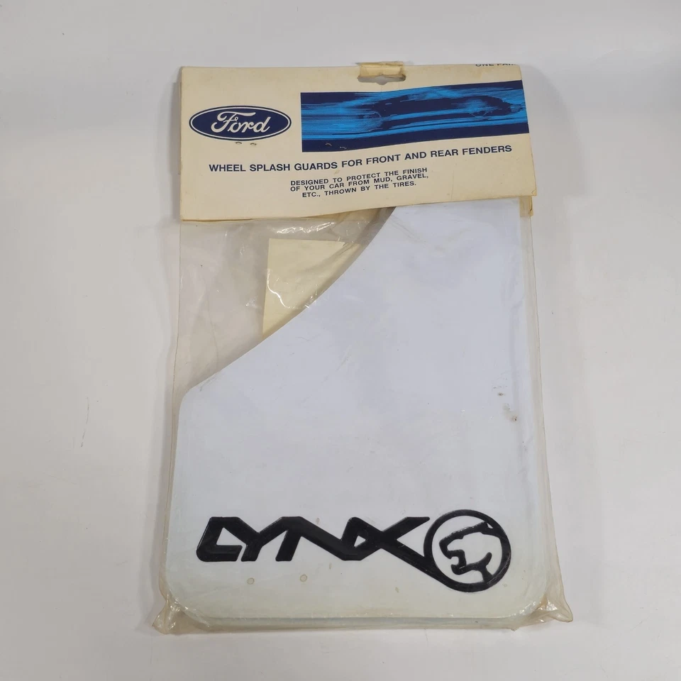 Paquete de 2 protectores contra salpicaduras de rueda vintage Ford Mercury LYNX OEM blancos (nuevo stock antiguo) Foto 1 de 3